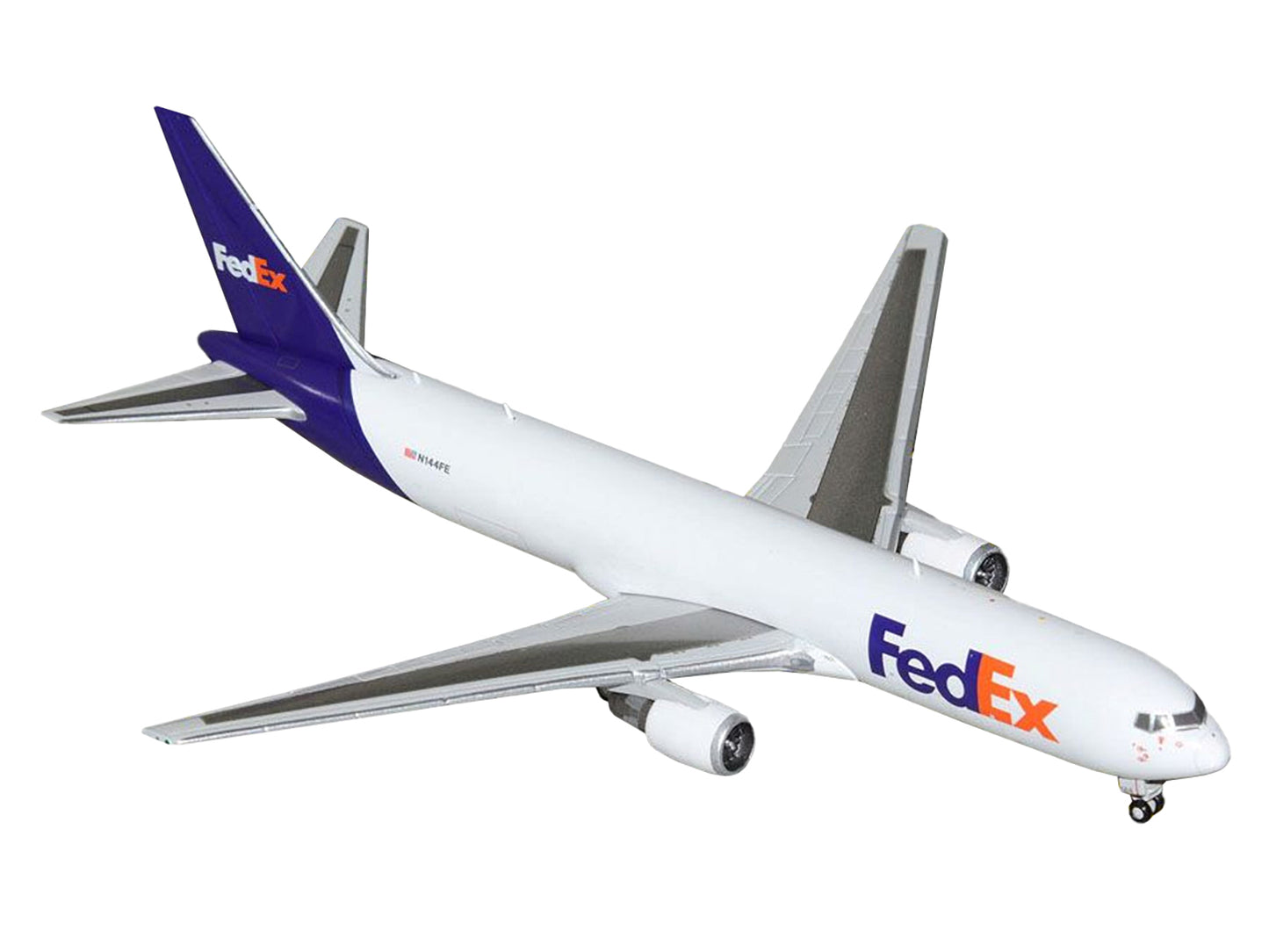 GeminiJets Boeing 767-300F Commercial Aircraft "FedEx (Federal Express)" (N144FE) White with Purple Tail 1/400 Diecast Model Airplane by GeminiJets