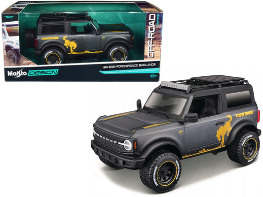 Maisto 2021 Ford Bronco Badlands Dark Gray Metallic with Gold Graphics and Roof Rack "Off-Road" "Maisto Design" Series 1/24 Diecast Model Car by Maisto