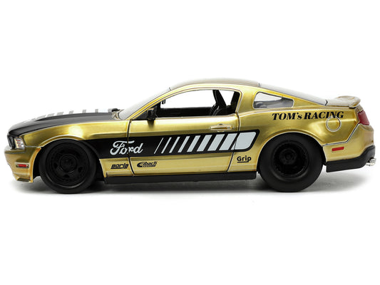 Jada 2010 Ford Mustang GT Gold Metallic with Black Graphics and Hood "Tom's Racing" "Bigtime Muscle" Series 1/24 Diecast Model Car by Jada