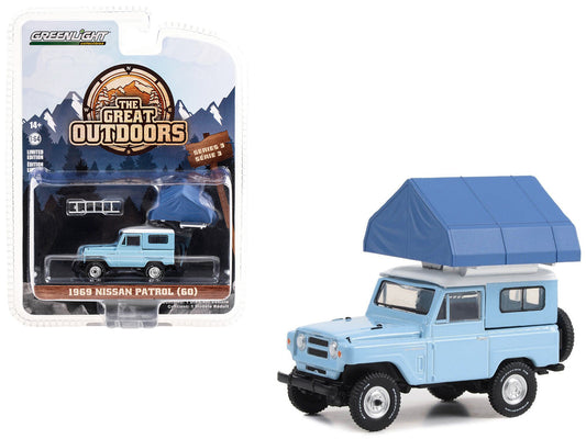 Greenlight 1969 Nissan Patrol (60) Light Blue with White Top and Camp'otel Cartop Sleeper Tent "The Great Outdoors" Series 3 1/64 Diecast Model Car by Greenlight