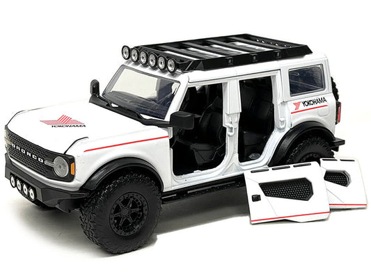 Jada 2021 Ford Bronco White with Red Stripes and Roof Rack "Yokohama Tires" "Just Trucks" Series 1/24 Diecast Model Car by Jada