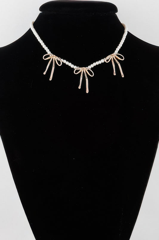 Pearl And Metal Ribbon Charm Necklace